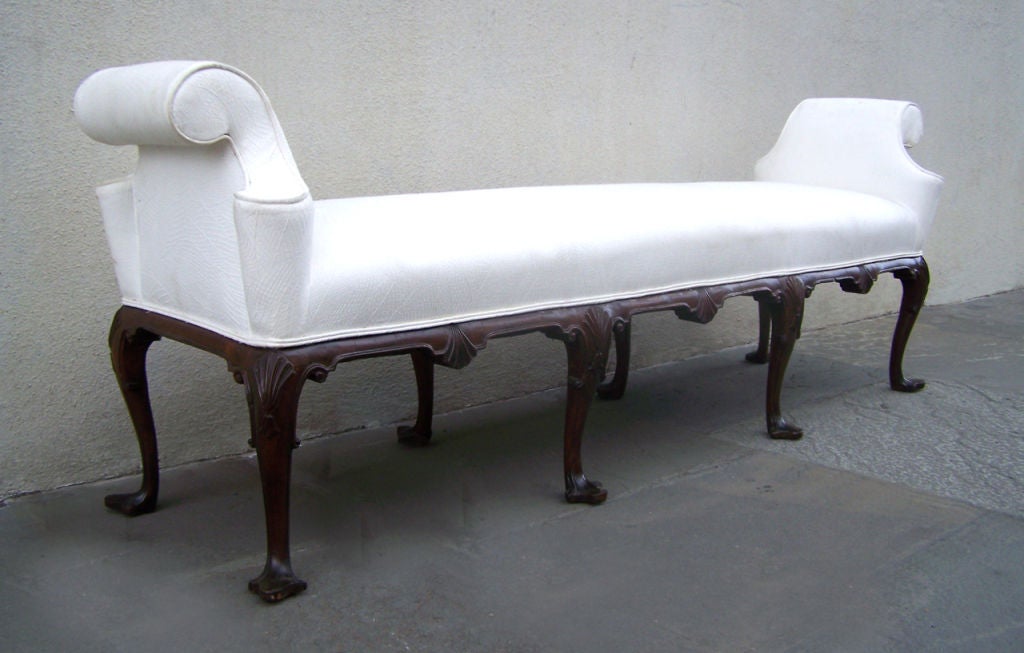 Very beautiful window bench with shell carved knees, clover feet, beautiful in-rolled arms and a shell center apron. Comfortable and attractive.