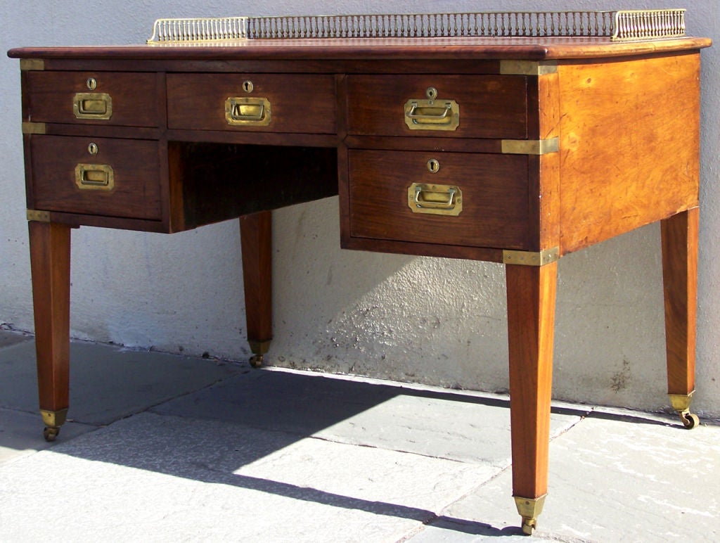 A 19th century mahogany Irish campaign desk, signed "Gregory Kane, 68, 69, 70 Dame Street, Dublin." It has embossed leather writing space, as well as original brass pulls and locks. Gregory Kane operated out of Dublin from about 1829-1865
