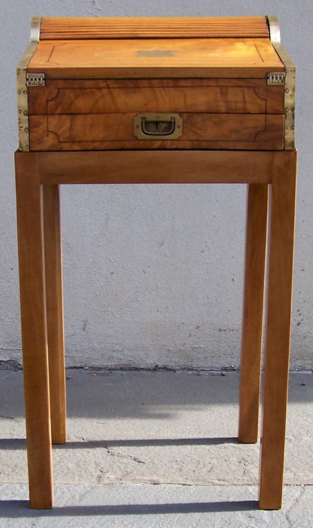 A early-19th century Asian hardwood lap desk on stand. A similar one is pictured in 