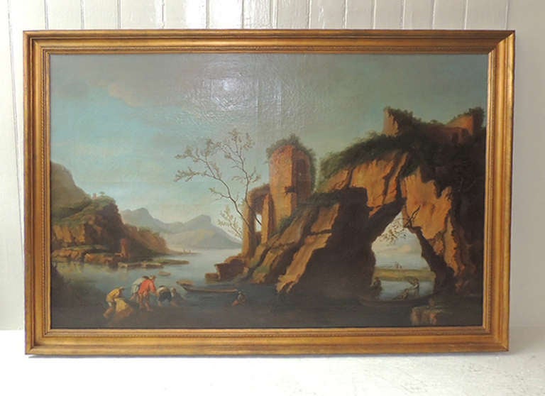 This 18th century painting features an Italian coastal scene centered in the mountain region of the country. Within the right and left part of the painting there are there are men who appear to be fishing and loading their boats into the water. The