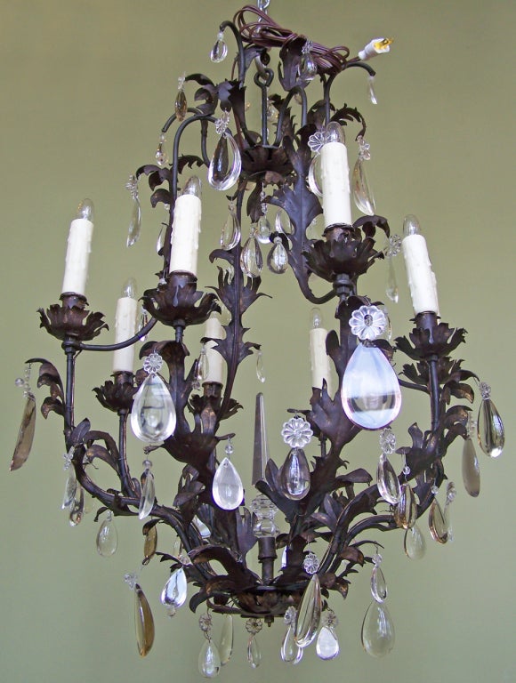 19th century hand-wrought birdcage chandelier with seven arms, foliate styling and crystal prisms. This piece was recently French wired for electricity.