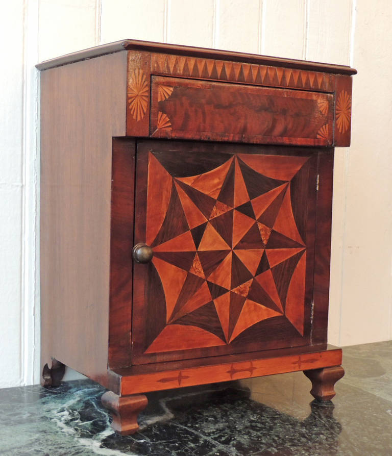 This Caribbean miniature demipress/spice cabinet was made in Jamaica in the 1830's and is attributed to Ralph Turnbull. This British Colonial piece is constructed with six different types of wood including yucca, mahogany, cedrela, rosewood,