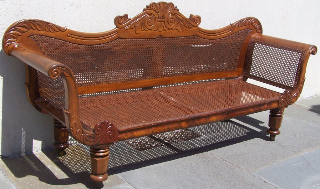 A beautiful, all hand caned and hand carved settee from Nevis. Turned feet, curved arms, carved headboard and flanking elements. 

West Indies, Nevis, Colonial, Caribbean,