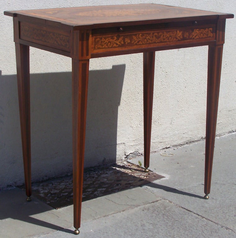 This is a beautiful 1800s English writing desk with one side drawer, a pull out felt writing slide, and gorgeous inlay