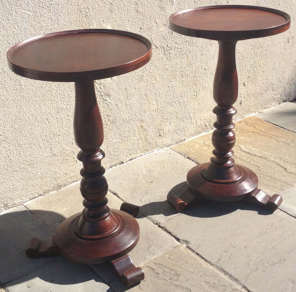 A matching pair of early 19th century Jamaican Regency mahogany occasional tables, circa 1830, featuring turned pedestal base on tripod base. 

West Indies, Caribbean, Jamaica, British West Indies, British Colonial, Island.
