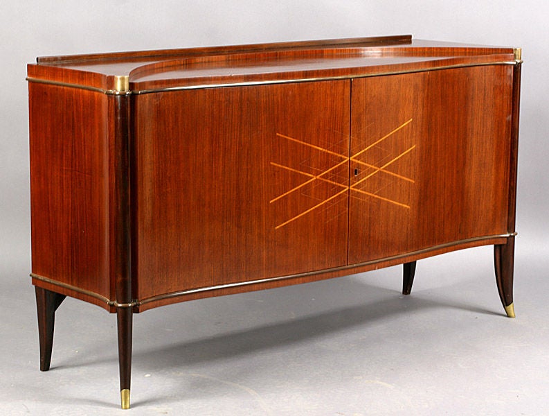 Serpentine Front Sideboard with a Stepped Top and Satinwood Inlaid Geometric Pattern Doors on Bronze Mounted Turned and Flared Legs.