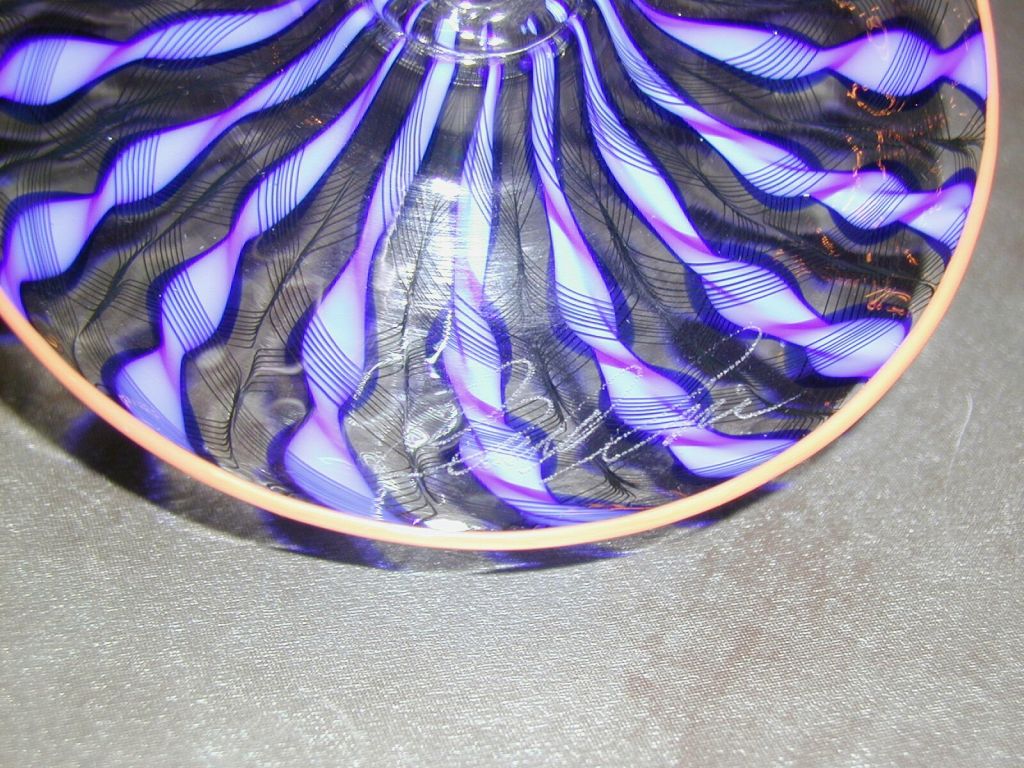 Magnificent Hand Blown Renaissance Art Glass Goblet with Tapered Bowl Decorated in Segmented Cobalt and Cerulean Blue Twisted Stripes Overlaid with Black Cross Hatching on a Clear Background Resting on Segmented Clear Cased Lyre Shaped Decoration