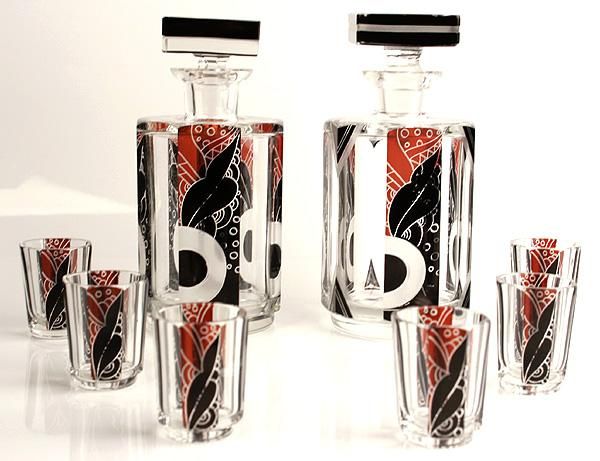Rare Czechoslovakian Set of Two Matching Octagonal Clear, Frosted and Intricately Etched Crystal Decanters and Six Matching Cordials with Black and Ruby Enamelled Geometric Panels. Height:  6.75