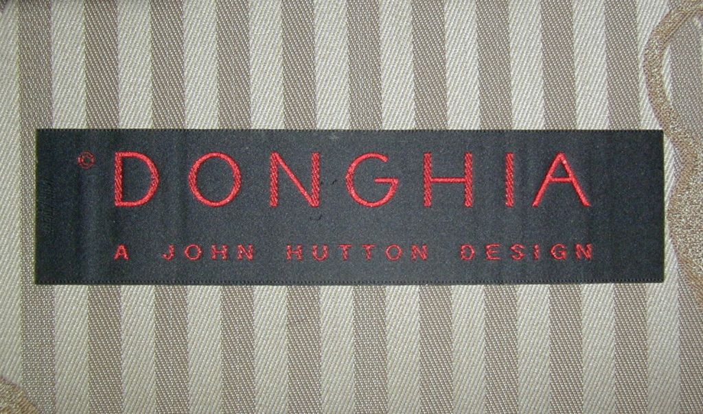 A John Hutton Designed Sofa in Donghia Beige Pinstripe Embossed with Heraldic Lions Upholstery for Donghia. An identical sofa is available to make a pair.
