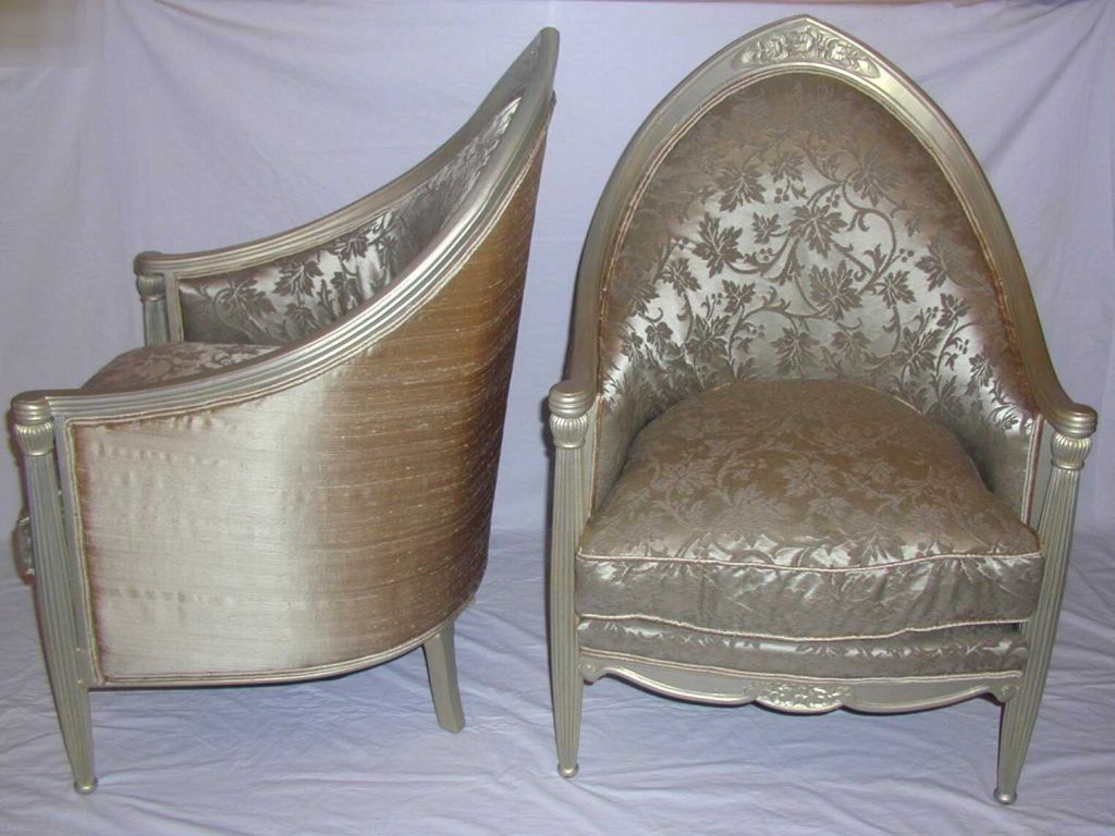 Pair of French Art Deco Silver Leaf Bergeres with Peaked Arched Backs and Carved Floral Decoration Culminating in Downswept Arms over Fluted Legs with Carved Floral Design on Apron Upholstered in Silver Ground Silk with Random Embossed Vines and