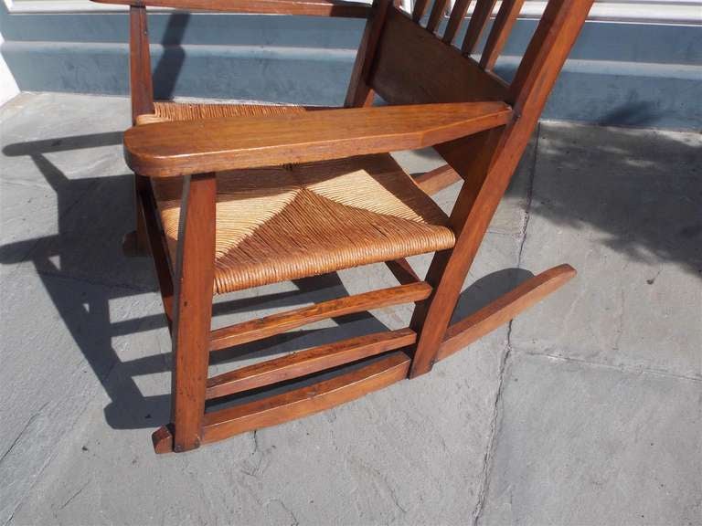 Late 19th Century American Walnut Rocking Chair with Rush Seat. Circa 1870 For Sale