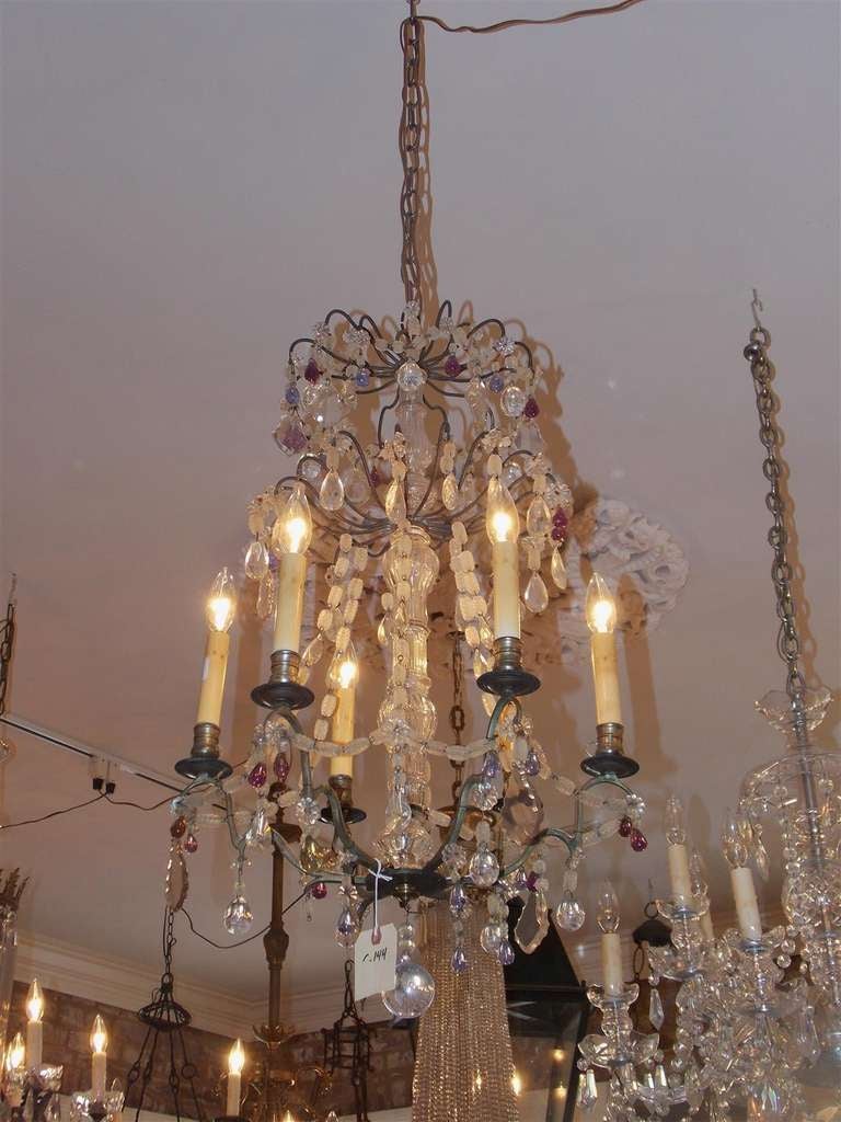French nickel silver over bronze and crystal six light chandelier with amethyst crystal fruit motif.  Chandelier was originally candle powered and has been electrified.  Early 19th Century