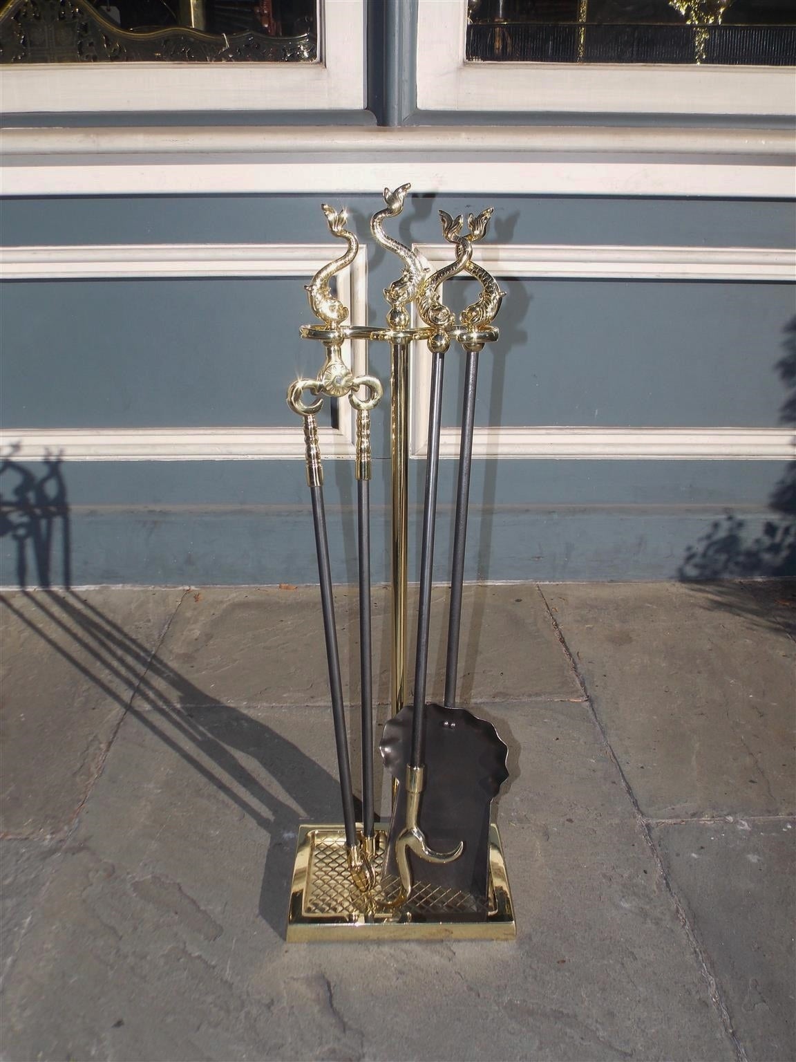 Set of English Regency Brass Dolphin Fireplace Tools on Stand, Circa 1850
