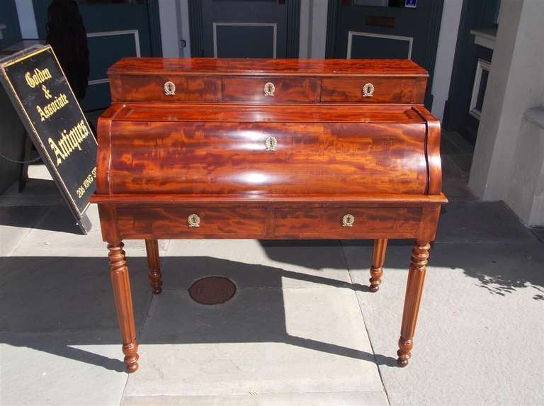 American crotch mahogany ladies fall front writing desk with birds eye maple fitted interior, pull out leather writing surface, three over two exterior drawers with original ormolu mounts, and terminating on turned bulbous reeded legs. 
Late 18th