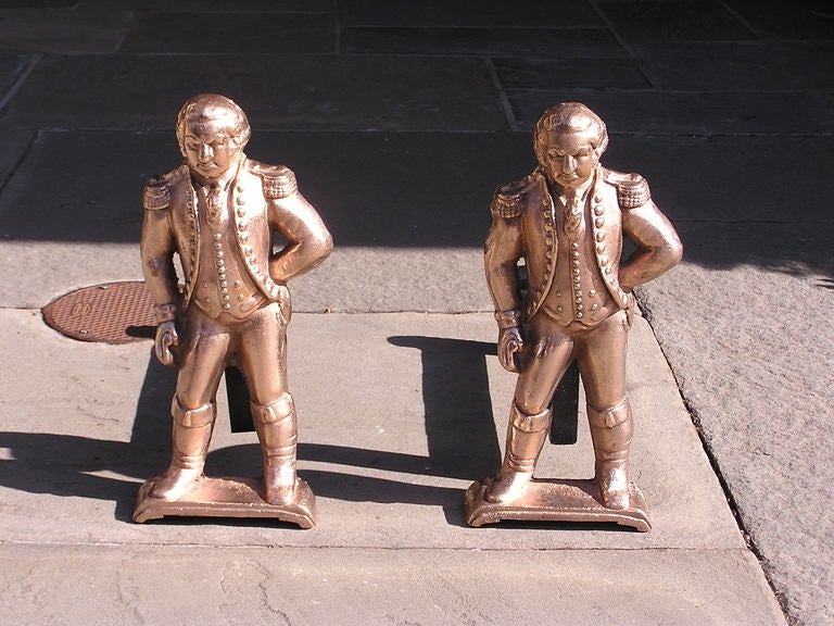 Pair of standing American bronze George Washington andirons in full military dress attire with iron dog legs. Dealers please call for trade price.