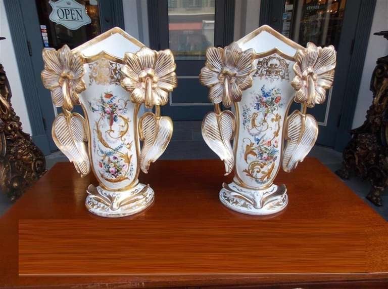 Pair of Old Paris Vases with hand painted floral and gilt motif. Vases have gilding on back as well.  Mid 19th Century