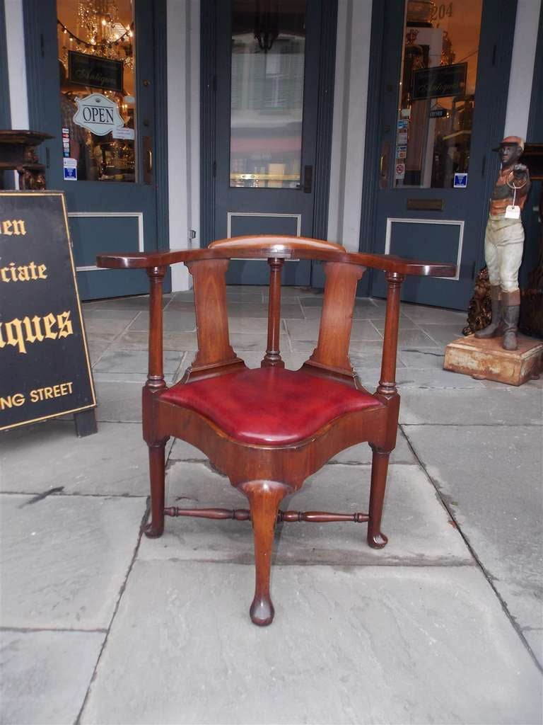 English mahogany Queen Anne corner chair with burgundy leather seat, turned stretchers, and terminating on pad feet. 18th Century