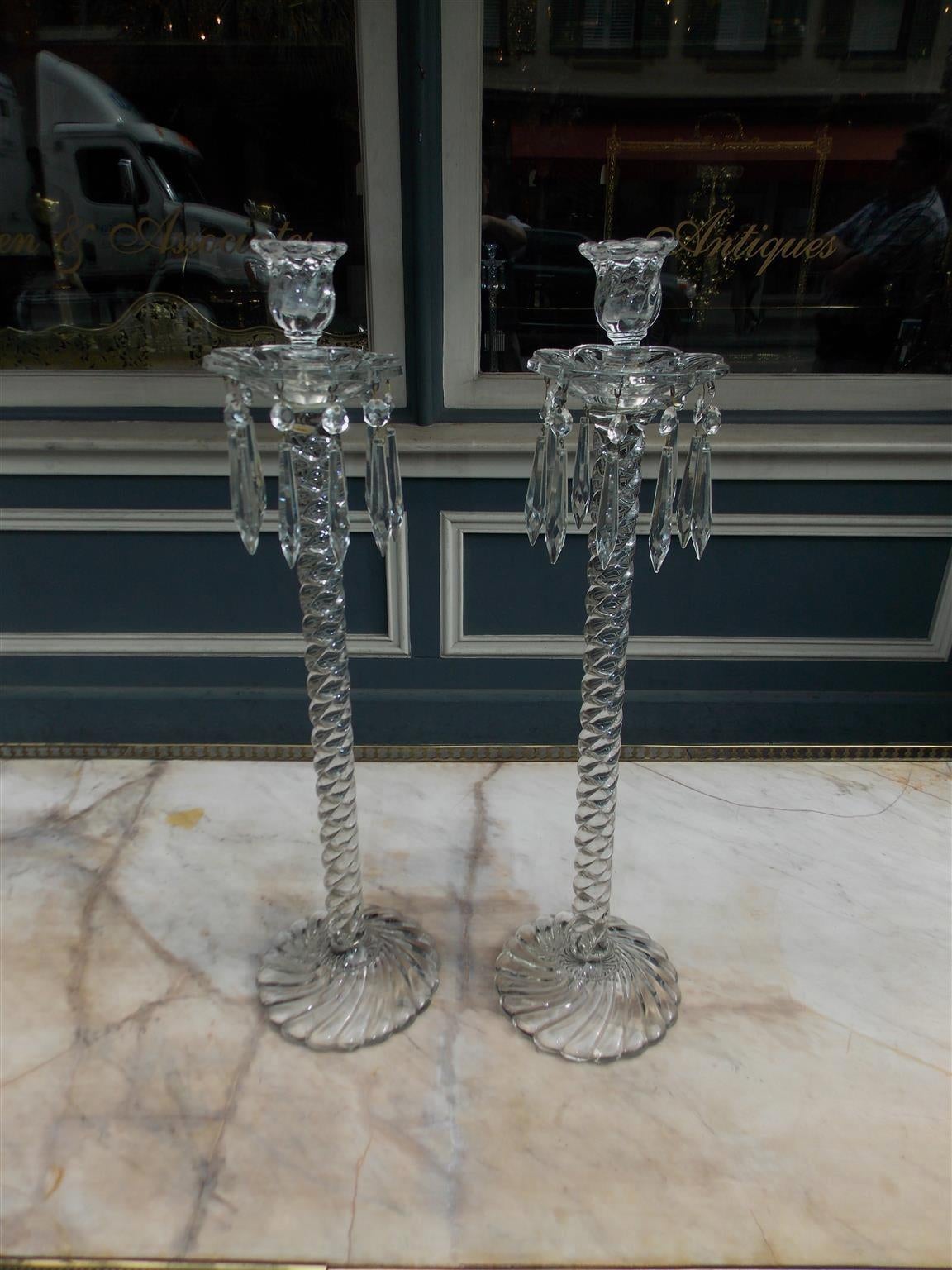 Pair of tall American Fostoria baccarat style crystal candlesticks with prism bobaches, spiral columns, and terminating on circular spiral base, Early 20th Century.