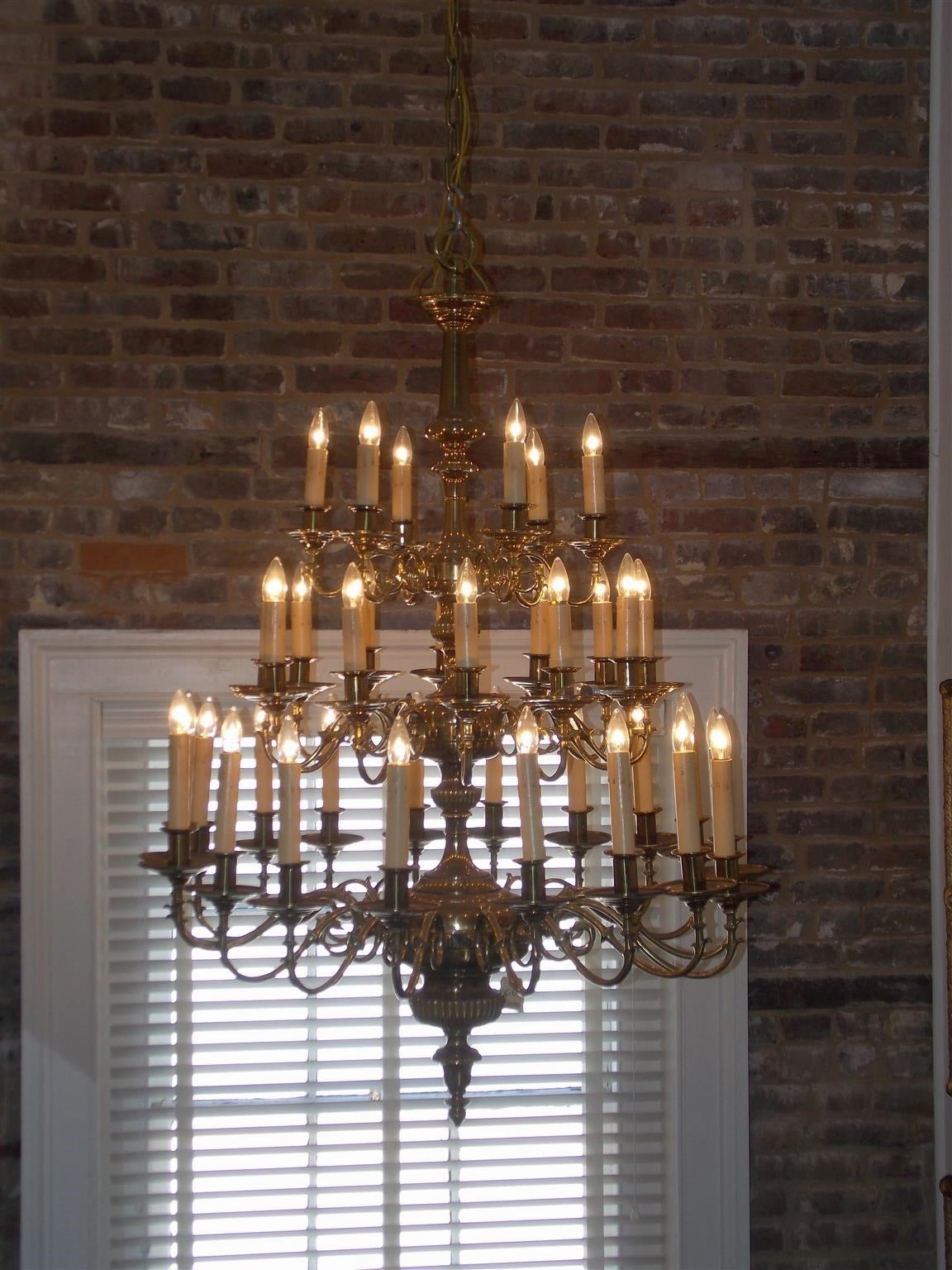 American Empire American Brass Monumental Three-Tier Chandelier. Circa 1850