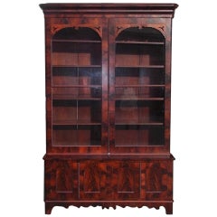 American Crotch Mahogany Glass Front Bookcase. Circa 1850