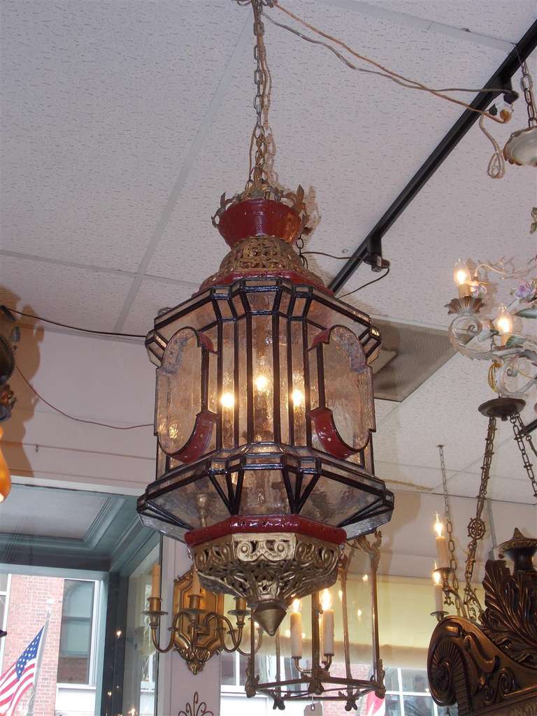 Moroccan gilt and hand painted eight light hanging lantern with original glass. Late 19th Century