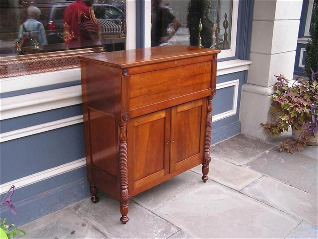 American Sheraton Cherry sugar chest with turned bulbous columns, two paneled door bottom, with original hinged flip top.           (Sumner County Tenneessee)