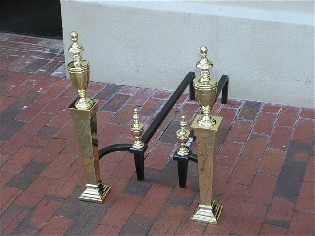 Pair of American brass andirons with urn top finial, urn finial log stop, and hand chased acorn & oak leaf motif