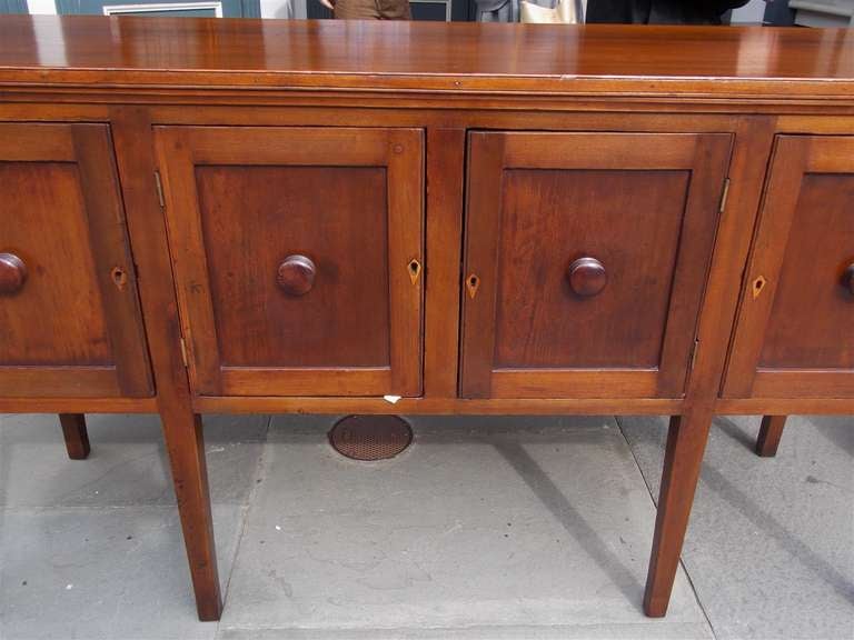 Early 19th Century American Walnut Paneled Sideboard with a Molded Edge and  Wood Knobs. 19th Cent.