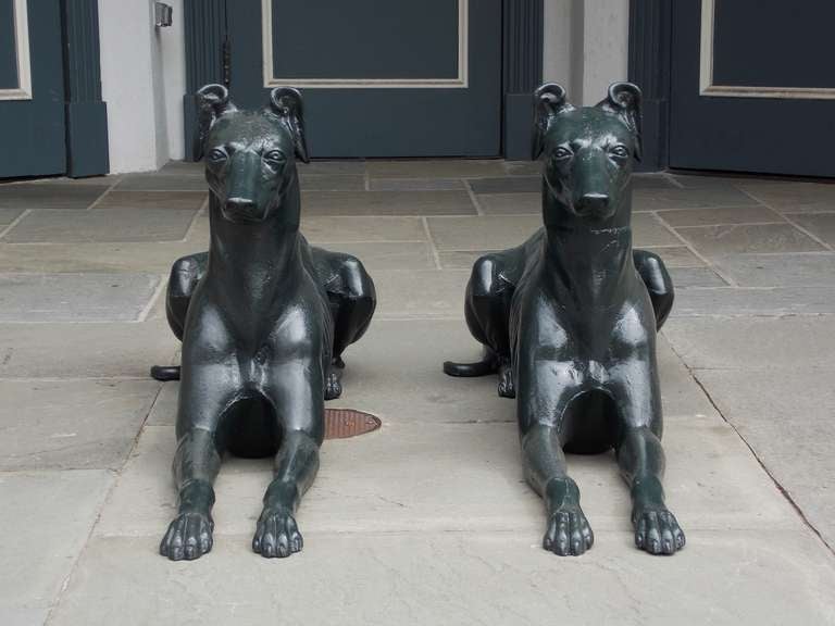 Pair of English cast iron greyhounds painted Charleston Green.  Early 19th Century