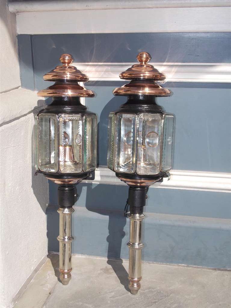 Pair of nickel silver, iron, and copper coach lanterns with the original beveled glass, Coach lanterns have the original mounting brackets. Early 19th Century.
Signed J. Lemone,  Bruxelles. Originally oil and pair has been electrified.