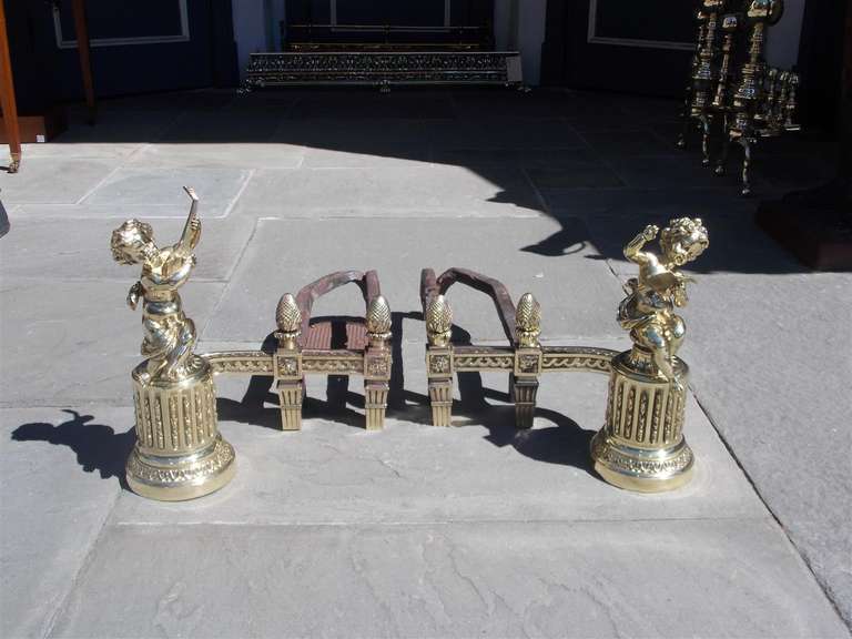 Pair of French Brass Cherub Musical Andirons. Circa 1820
