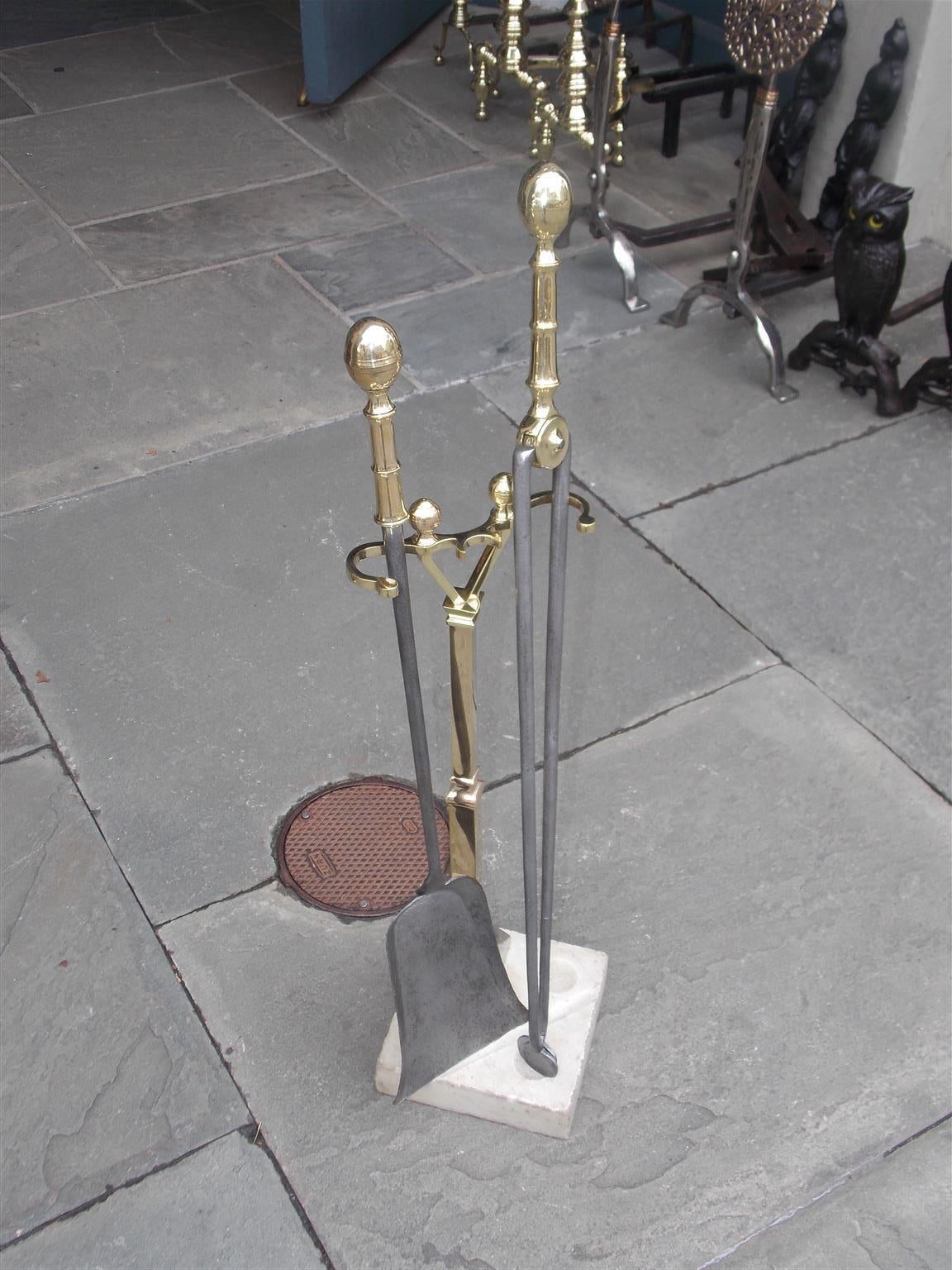 American brass and polished steel lemon top tools on Stand with squared marble base, Early 19th century.