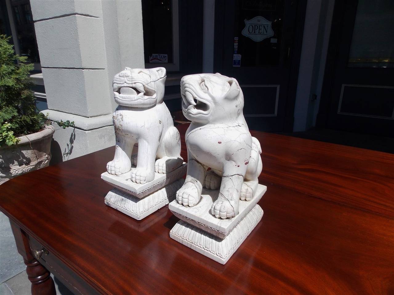 Hand-Carved Pair of Chinese Carved Stone Foo Dogs on Rectangular Plinths, 20th Century For Sale