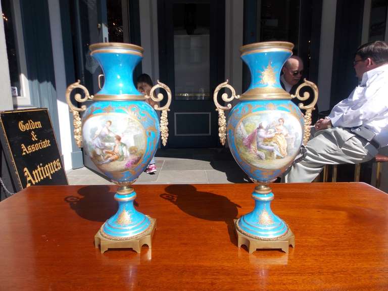 Pair of Sevres hand painted vases with original ormolu mounts. Early 19th Century