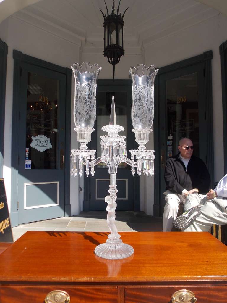 French Baccarat crystal candelabra with original double etched hurricane shades terminating on cut crystal frosted cherub base . Late 19th Century