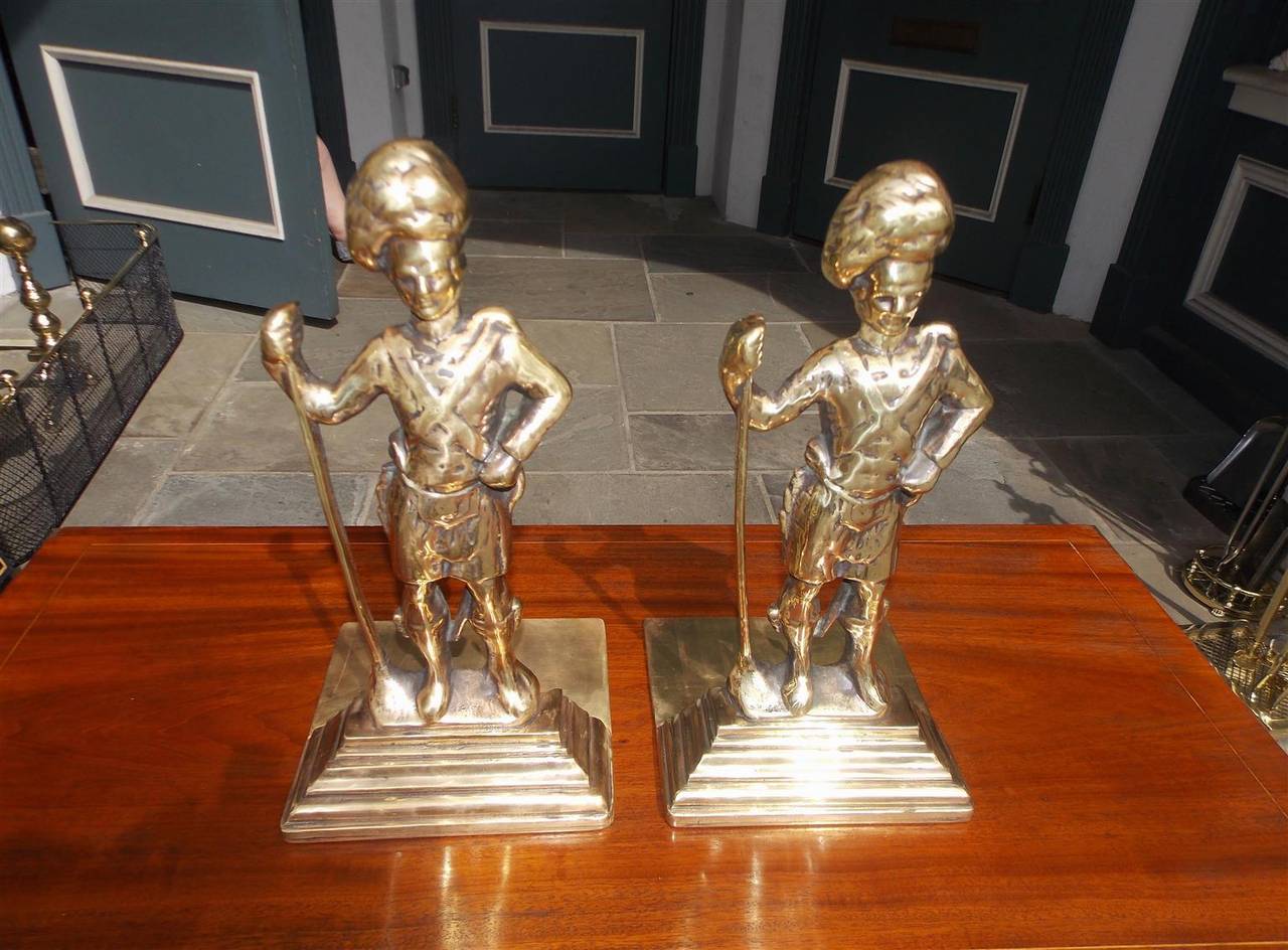 Pair of brass Scottish Highlander Royalty Guards bookends / doorstops dressed in full military attire.  Mid 19th Century.