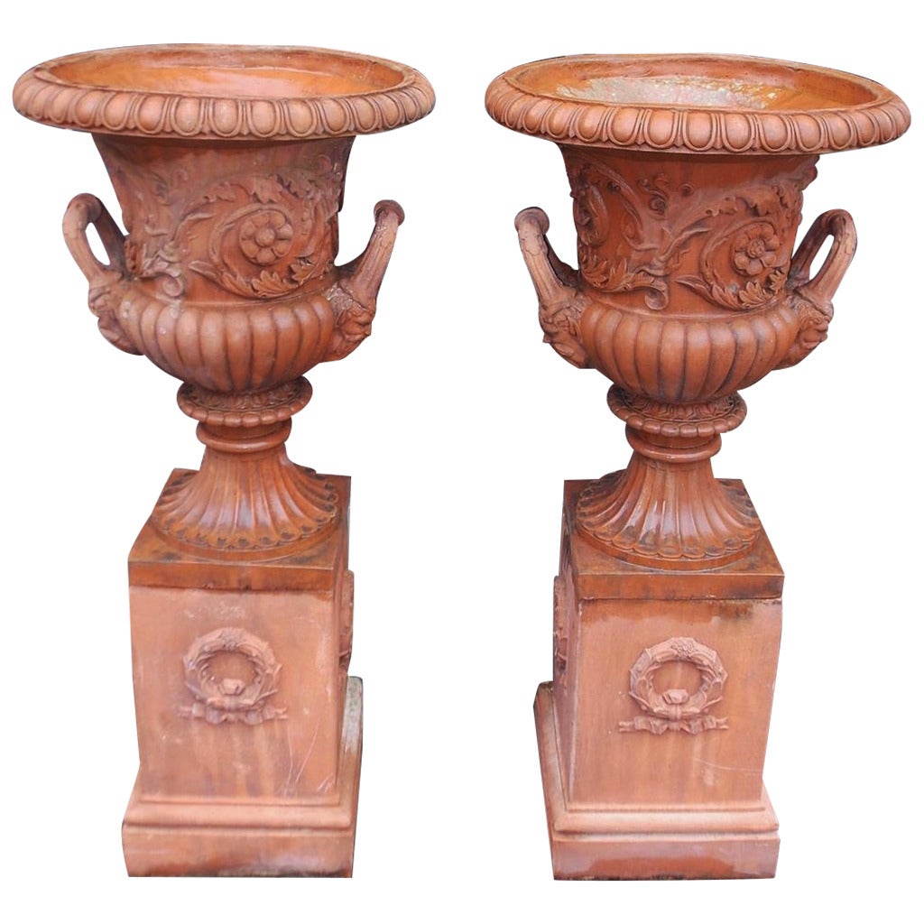 Pair of Italian Terracotta Floral Urns on Raised Plinths, Circa 1840 For Sale