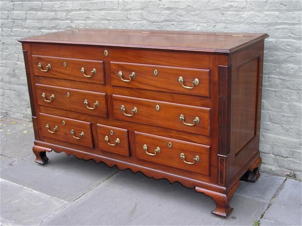 English mahogany hinged top mule chest with carved molded edge, reeded  sides, carved scalloped skirt, satinwood boxing inlay, original brasses,  and terminating on original ogee bracket feet. Late 18th Century
