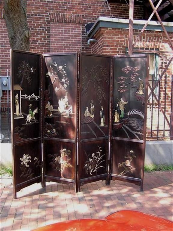 Chinese four panel laquered coromandel screen with carved soap stone, ivory, and stenciled chinese writing on reverse side.