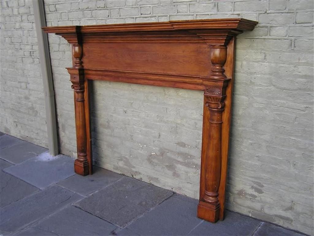 American white pine fireplace mantel with carved molded edge top , flanking urns & bulbous columns, & carved sunburst motif . All original . Early 19th Century . Firebox Interior Dimensions are 36.75