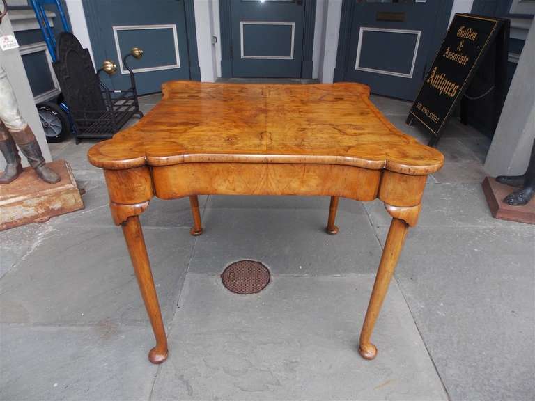 English Queen Anne Burl Walnut games table with outset rounded corners, carved knee, and terminating on tapered legs with pad feet.  18th Century