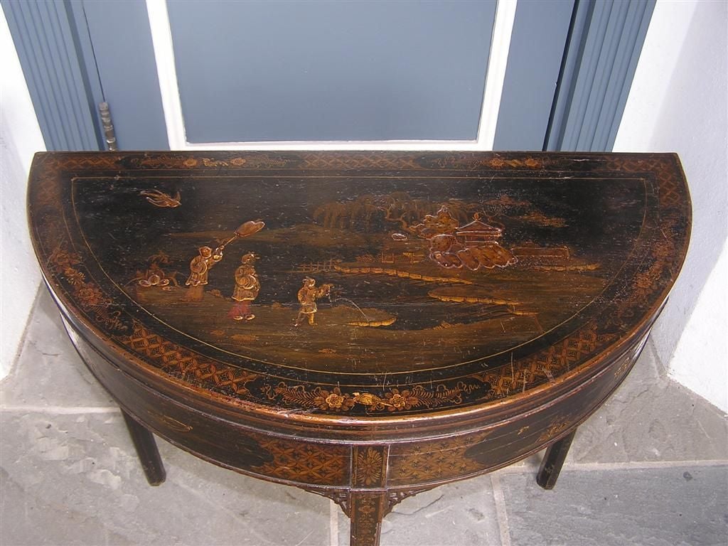 English Chinoiserie stenciled one drawer game table with flip leather top and carved fret work corners.