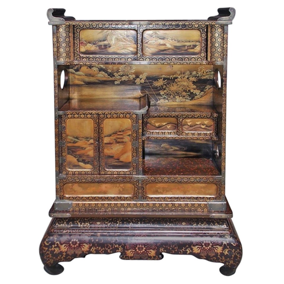 Japanese Lacquered and Stenciled Cabinet on Stand. Circa 1840