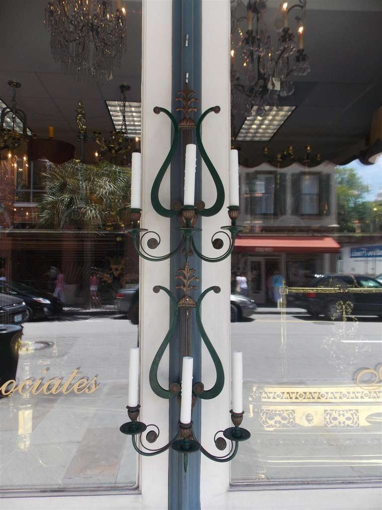 Pair of American three arm bronze and painted lyre back sconces with floral medallions and bell flower motif. Signed by the New York maker, Sterling Bronze Co.