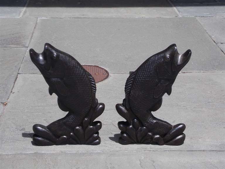 Pair of American cast iron aquatic fish andirons jumping out of water with original dog legs.  Early 20th Century