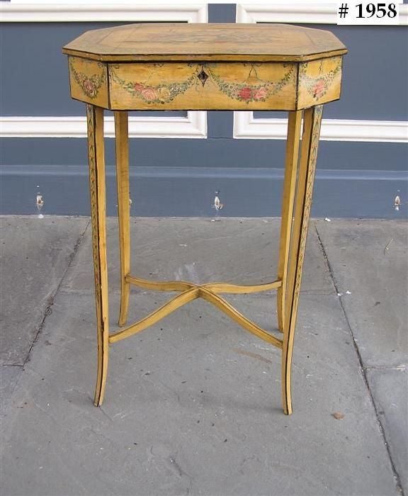 French hand painted flip top dressing table with floral paintings , ebonized string inlay, foliage border with swags,  connecting cross stretchers , and terminating on tampered splayed legs . Late 18th century.