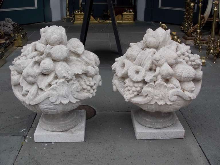 Hand-Carved Pair of Italian Hand Carved Sandstone Fruit Baskets on Plinths. Circa 1830