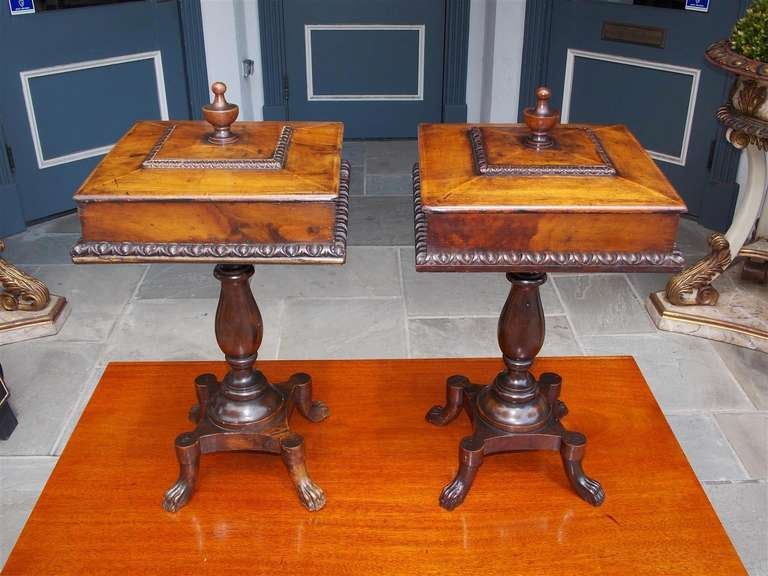 Pair of English mahogany hinged top humidors with centered urn finial, tiered lambs tongue , turned bulbous ringed pedestals, and terminating on rectangular lions paw feet. Late 18th Century   