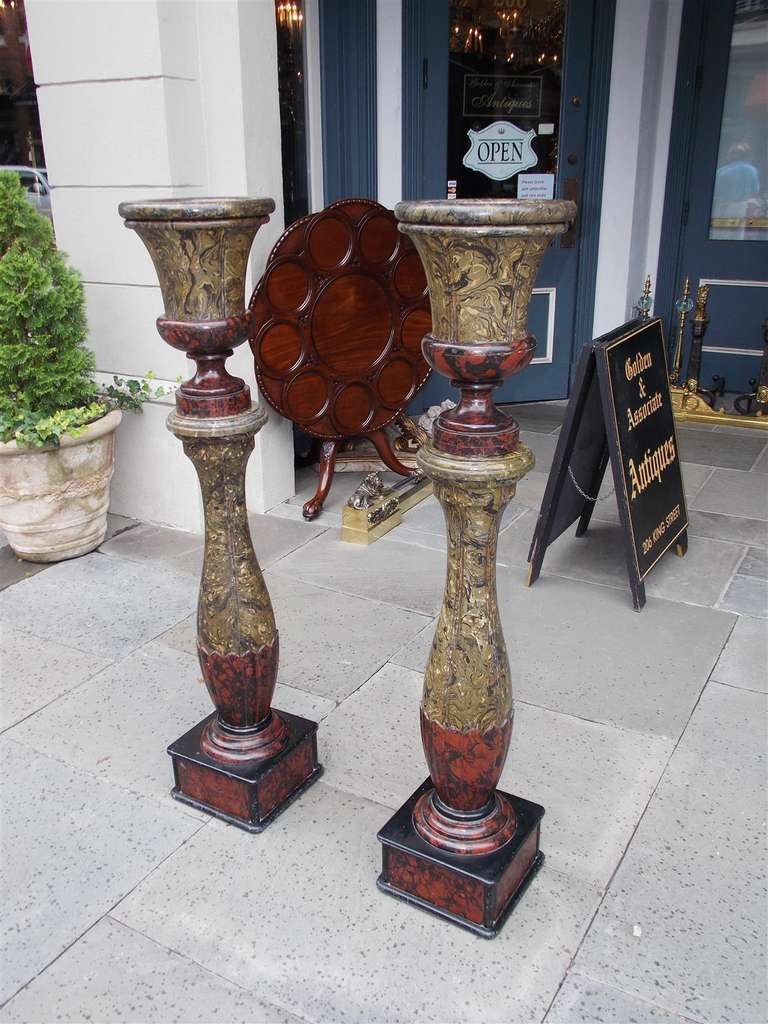 Hand-Carved Pair of English Faux Painted Campaign Urns on Bulbous Columns. 19th Century