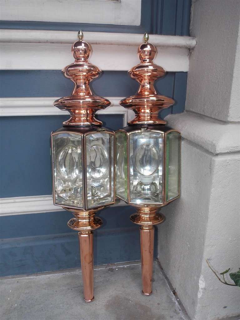 Pair of American copper over brass and nickel silver coach lanterns with original beveled glass. Signed James Cunningham and Son. Mid 19th Century